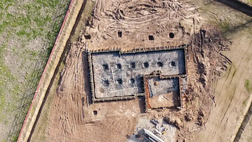 Aerial view of gray concrete building, block foundation in Washington NC