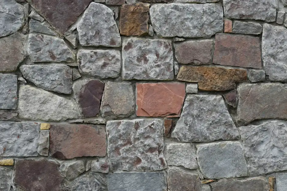 A close up of a stone wall made of rocks, block foundation in Greenville NC