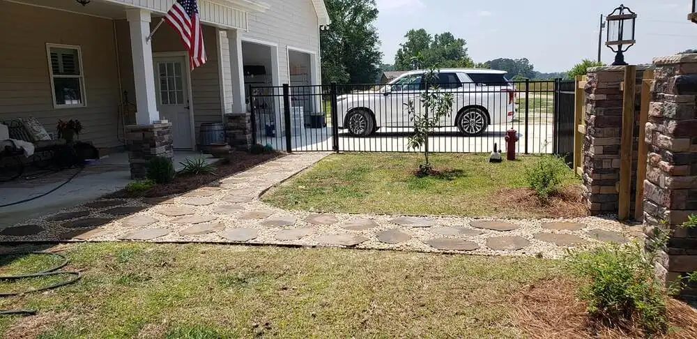 Brick columns along a front yard walkway from a masonry contractor