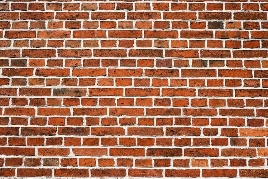 An old red brick wall with white mortar lines, brick masonry in Belhaven NC