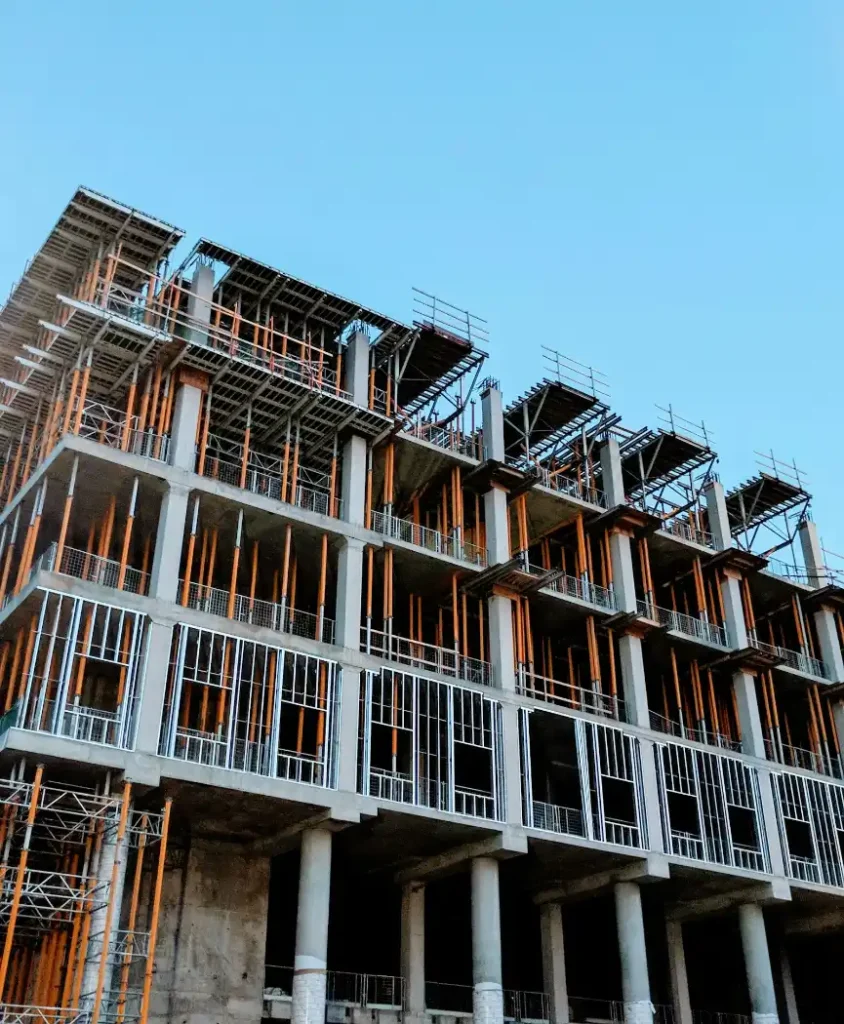 Gray concrete building under construction, concrete cutting in Greenville NC