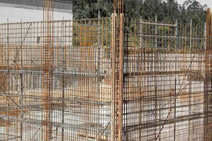 Rusty rebar grids forming a structure at a construction site, concrete footing in Greenville NC