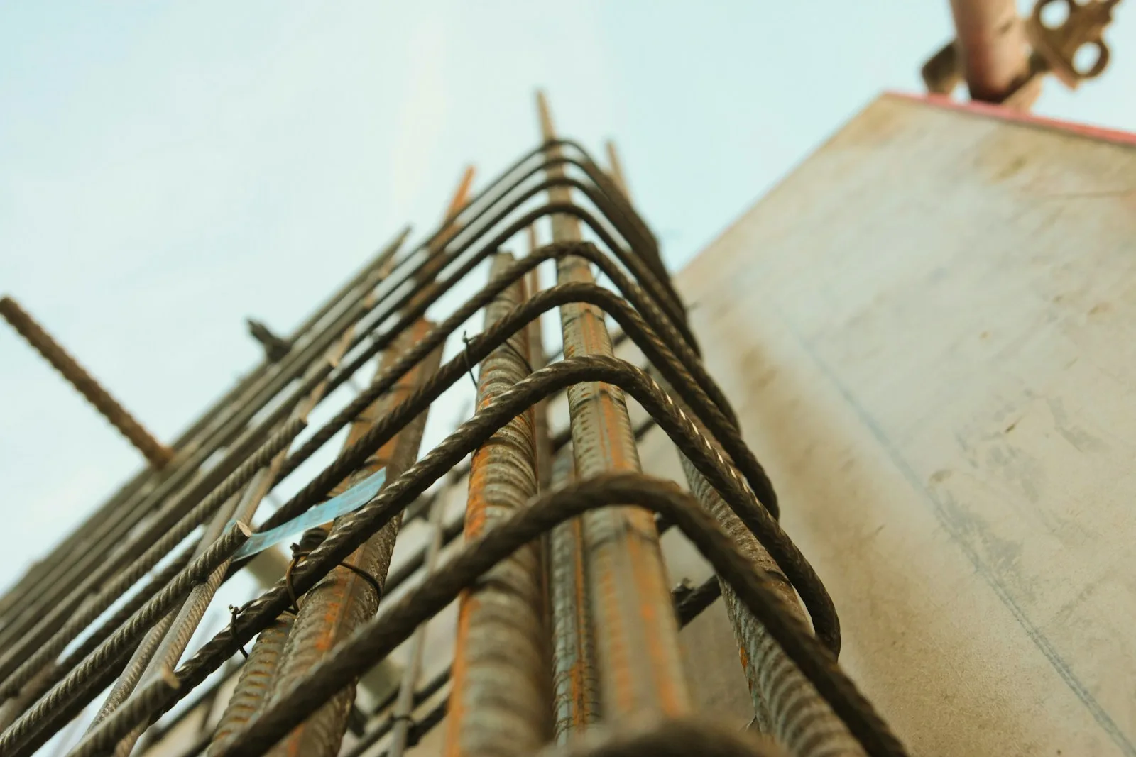 Worm's-eye view photography of rebar, concrete footing in Greenville NC