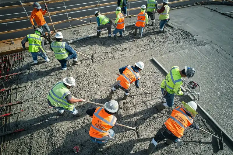 Workers in a construction site, concrete slab in Greenville NC