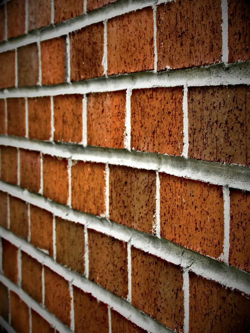 Brown concrete wall close-up photography, masonry repair in Greenville NC