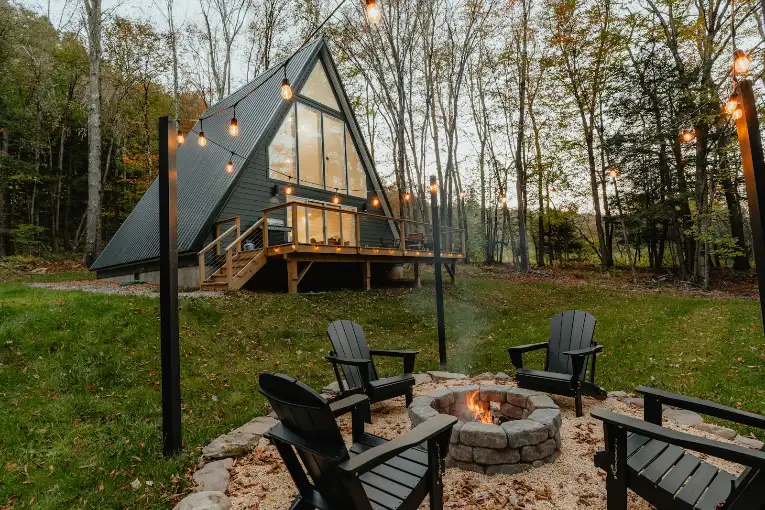 A small cabin with a fire pit in the yard, outdoor fire pit in Greenville NC