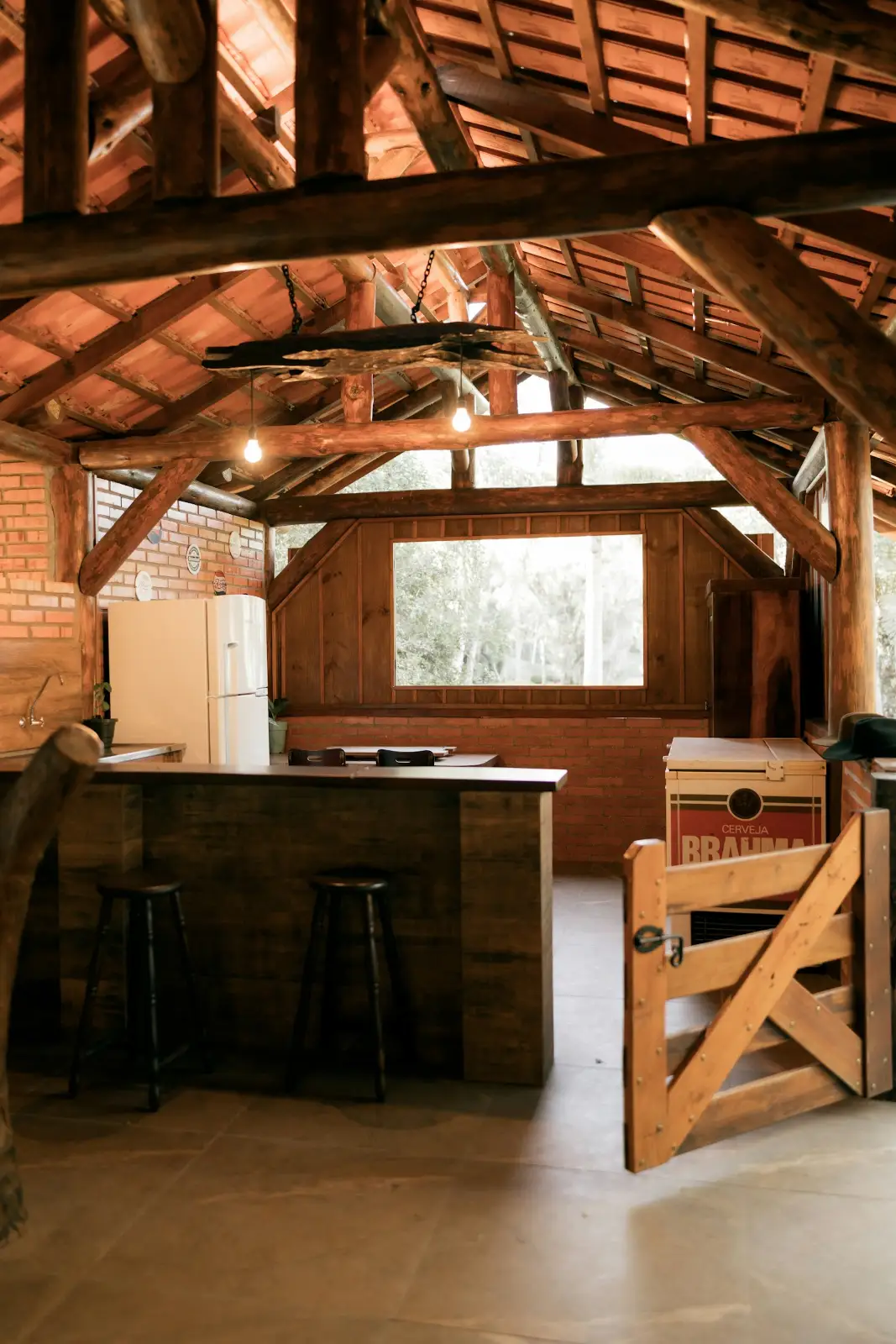 Rustic wooden kitchen with bar and stools, outdoor kitchen in Greenville NC