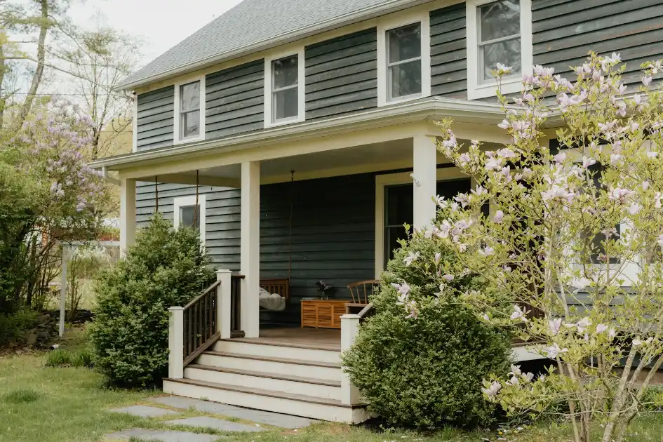 A house with a porch and steps leading to the front door in Greenville NC