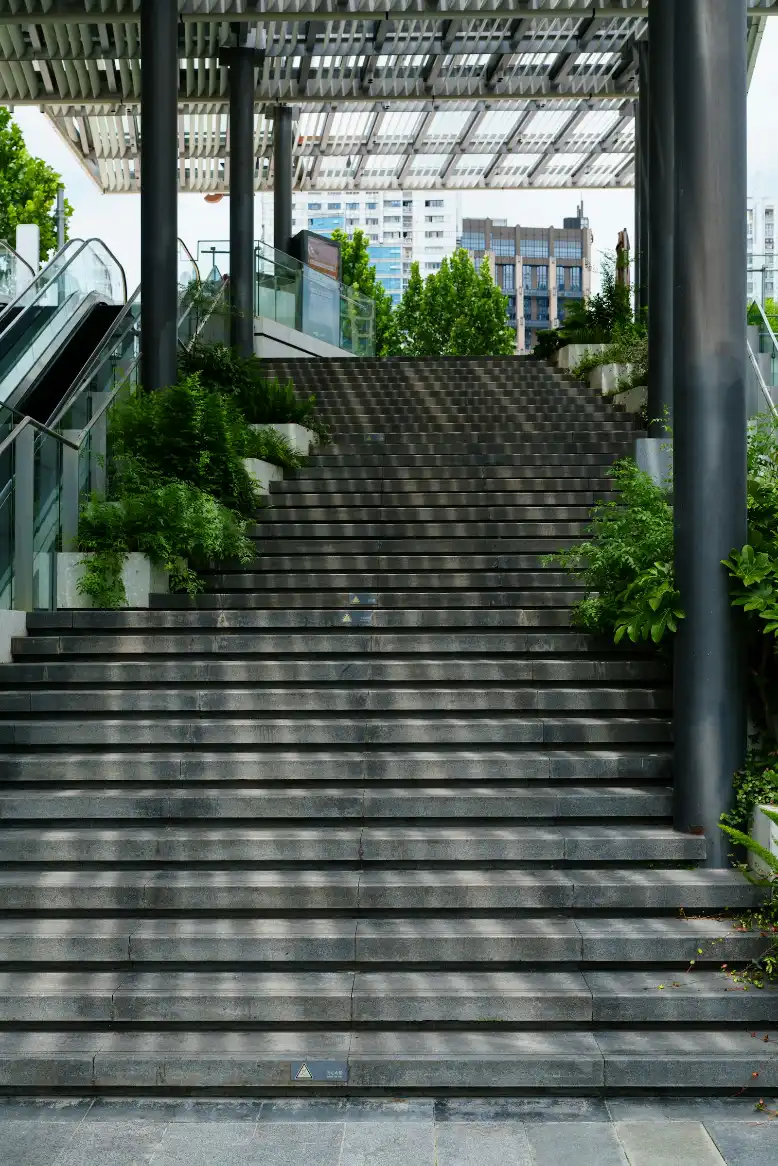 Outdoor stairs leading up to a modern building entrance, porch steps in New Bern NC