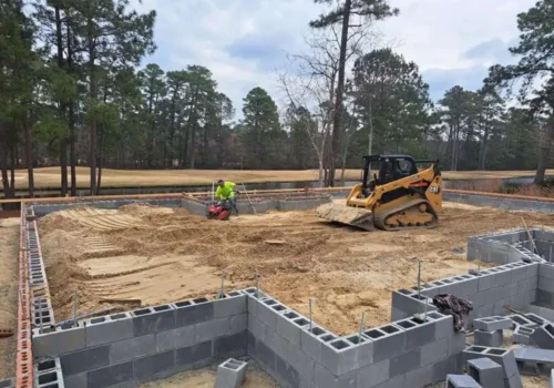 Block foundation work with a skid steer