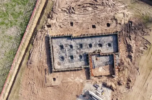 Aerial view of gray concrete building, block foundation in Washington NC