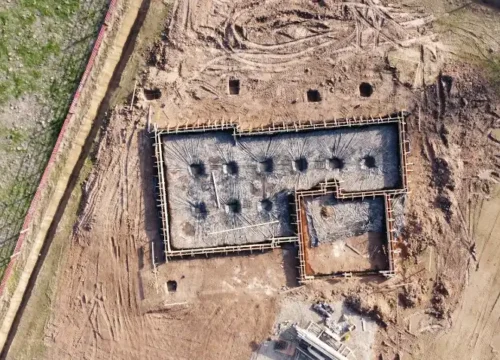 Aerial view of gray concrete building, block foundation in Washington NC