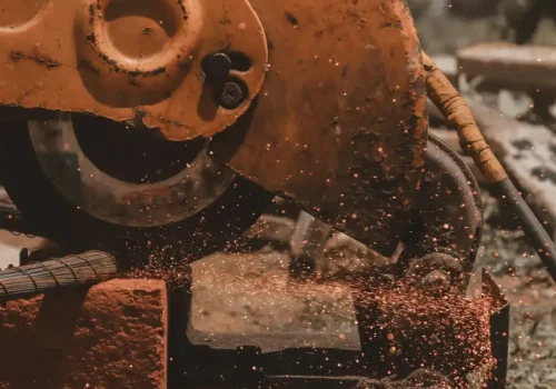 A close up of a machine cutting a piece of wood, concrete cutting in Greenville NC