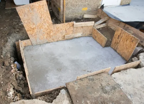 Brown concrete blocks on brown soil, concrete footing in Greenville NC