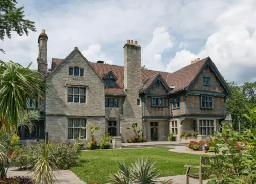 Large stone and timber house with manicured garden, concrete footing in Greenville NC