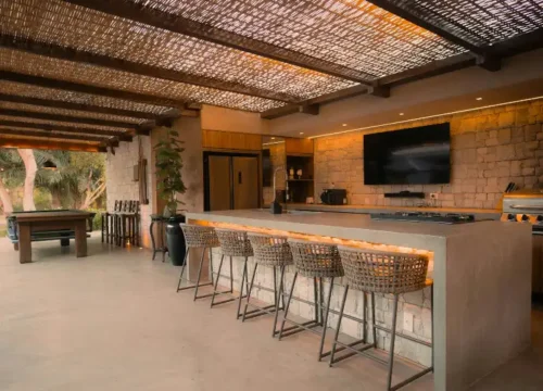 Modern outdoor kitchen with island and bar stools in Greenville NC