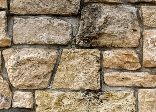 A close up of a stone wall made of rocks, stone masonry in New Bern NC