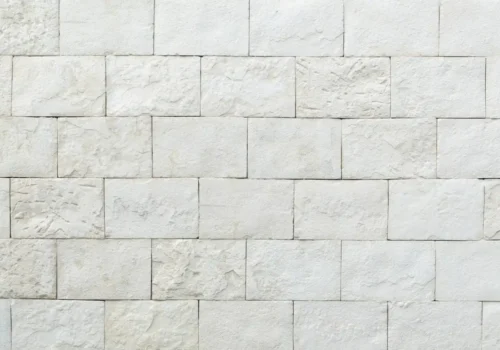 White concrete wall, stone masonry in New Bern NC